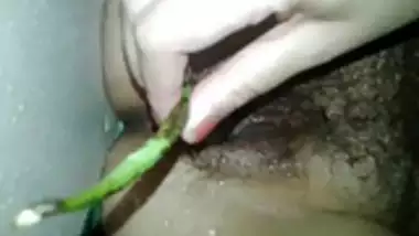 Hot Indian wife Binitha taking veggie in her pussy