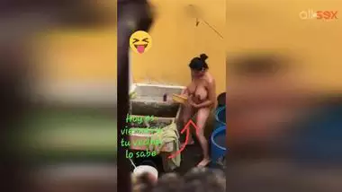 Horny Desi aunty fingering hairy pussy while bathing in a outdoor