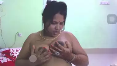 Sexy aunty displays soft boobs and licks nipples before masturbation