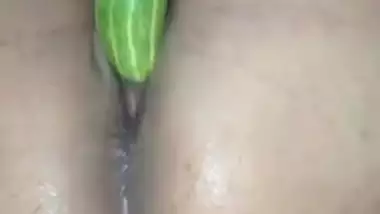 Horny girl using cucumber to masturbate, but it doesn’t fit